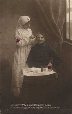 an old photo of a man getting his hair cut by a woman in front of a window