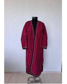 Add a unique and exotic touch to your wardrobe with this antique Turkmen silk kaftan, also known as a kimono or chapan. This original piece from the 1960s is a great addition to any collection. It is made of hand-woven silk and cotton fabrics used as a lining. The embroidery is all silk. Used. It showcases the vibrant and colorful Turkmen regional design. The multicolored silk material adds a touch of luxury to the piece. Perfect for cultural events, this Turkmen traditional dress is a must-have Long Embroidered Festive Kimono, Long Embroidered Kimono For Festive Occasions, Traditional Kimono With Resham Embroidery, Ceremonial Long Sleeve Handloom Traditional Wear, Traditional Fitted Kimono For Festive Occasion, Festive Traditional Fitted Kimono, Fitted Traditional Kimono For Festive Season, Embroidered Front Open Traditional Wear For Eid, Traditional Embroidered Front Open Dupatta