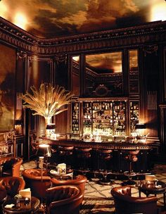 a fancy bar with high ceilings and chandeliers