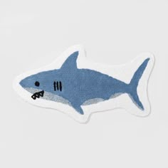 a blue and white shark shaped rug