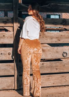 Introducing our Stay Golden Paisley Flare Pants - the perfect combination of retro chic and boho vibes! These gorgeous mustard bell bottom pants feature a stunning paisley floral burnout design and a trendy lace up front. With an elastic waistband and stretch fit, they're as comfortable as they are stylish. Stay golden! 95% Polyester, 5% Spandex Size small fits 0-4, medium 6-8, large 10-12, XL 14-16 Grace is 5'4" wearing a size small Bohemian Pants Outfit, Bohemian Pants, Bell Bottom Pants, Boho Vibe, Swimwear Sale, Style And Grace, Retro Chic, New Tops, Pants Outfit