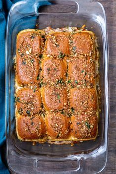 a casserole dish filled with bread and topped with parmesan sprinkles