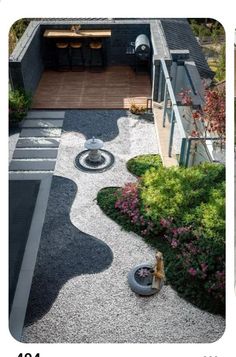 an aerial view of a backyard with gravel and rocks in the foreground, landscaping on the other side