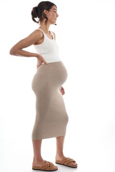 An easy-wear maternity crop made in our premium stretch knit. Minimalist in design, it features a scoop neck and neat fit. It's the perfect base layer for any outfit. Easy to dress up or down, you'll want this in all three colours. Preg Outfits, Maternity Crop Top, Birthing Gown Hospital, Maternity Crop Tops, Mum Outfits, Pregnancy Outfit, Pregnant Model, Maternity Wardrobe, Pregnancy Style