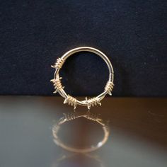 a gold ring sitting on top of a table