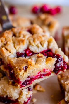 cranberry cobbler bars cut into squares on a cutting board