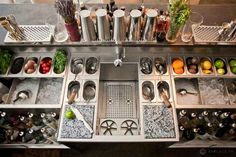 an assortment of food is displayed on the counter in front of other dishes and utensils