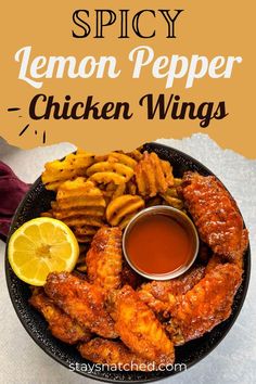 a plate with chicken wings, french fries and dipping sauce on it that says spicy lemon pepper chicken wings