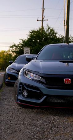 two cars parked side by side on the road