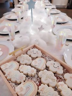 a table is set with cookies and plates