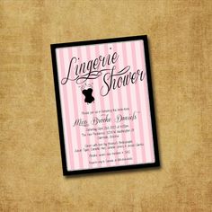 a pink and black baby shower card with a teddy bear on it's back