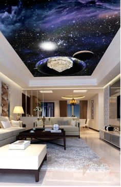 a living room filled with lots of furniture and a ceiling painted with blue galaxy stars