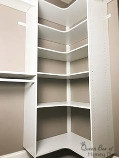 the corner of a closet with shelves in it