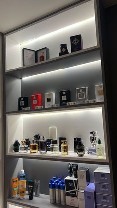 the shelves are filled with different types of perfumes