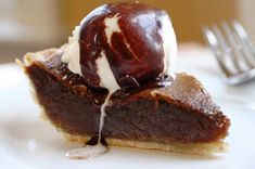 a piece of chocolate pie with ice cream on top