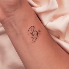 Floral Letter Tattoo | tattoo ideas by  Ciarra Dickey Motherhood Tattoos, Tiny Wrist Tattoos, Small Forearm Tattoos, Mommy Tattoos, Writing Tattoos, Mother Tattoos, Initial Tattoo