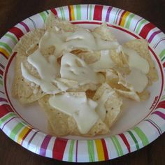 a plate topped with chips covered in white frosting