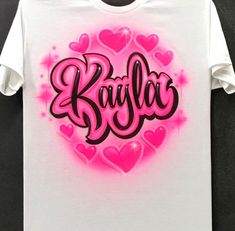 Airbrushed name with hearts design airbrushed in your choice of colors  I airbrush on quality 50/50 Gildan brand t shirts and Gildan Heavyweight hoodies. Adult hoodies have drawstrings and youth sizes do not have drawstrings. I use water based acrylic fabric paint for a long lasting product  WASHING INSTRUCTIONS  Always wash your airbrushed apparel in cold water, no bleach, and air dry to get the longest life from your new shirt  Consult the size chart in the photos to be sure that you order the correct size Personalized Football Gifts, Water Based Acrylic Paint, Hearts Design, Detailed Coloring Pages, T Shirt Crop Top