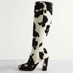 Step out in style with these chic black white cow-print knee high boots featuring a trendy square toe design and block heel, perfect for making a bold fashion statement. Color: Black White Heel Type: Block heel Heel Height: 4'' / 100 mm approx Product measurements were taken using size 8. Please note that measurements may vary by size. Toe: Square toe Cow-print design Side-zipped design Handcrafted US sizing. Fits true to size. Block Heel Knee High Boots, Amina Muaddi Shoes, Heel Knee High Boots, Black And White Heels, Cowboy Shoes, Amina Muaddi, Boot Print, Shoe Inspo, Pony Hair