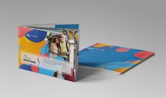 an open brochure with colorful shapes on the front and back cover is shown