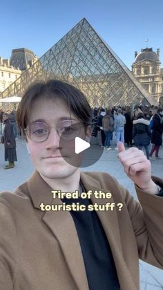 a woman with glasses pointing at the camera in front of a pyramid and text that reads, tired of the touristic stuff?