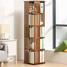 a tall wooden book shelf with books on it in a room next to a window