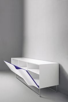 a white shelf with blue lines on the top and bottom, against a gray wall