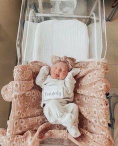 a baby is laying in a hospital bed