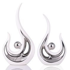 pair of silver earrings with spiral design on white background stock photo - 1307982