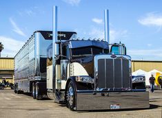 a large semi truck parked in a parking lot