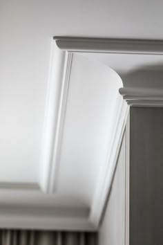 the corner of a ceiling with white paint