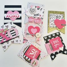 several valentine's day cards laid out on top of each other with hearts and ribbons