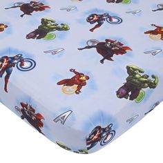 the avengers baby crib sheet is shown with various cartoon characters on it and blue background