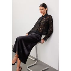 Black lace (55% Nylon, 45% Cotton). Top. Long sleeves. Collar. Front button closure. 22" from shoulder to hemline. Imported. Chic Formal Blouse With Lace Patchwork, Elegant Fall Blouse With Lace Patchwork, Elegant Lace Patchwork Blouse For Fall, Elegant Lace Patchwork Top For Fall, Elegant Fall Lace Patchwork Top, Spring Evening Blouse With Lace Patchwork, Evening Blouse With Lace Patchwork For Spring, Fall Party Lace Top, Formal Fall Lace Top With Lace Trim