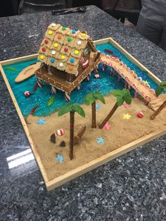 a cake made to look like a house on the beach