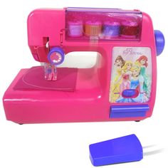 a pink sewing machine with princess pictures on it