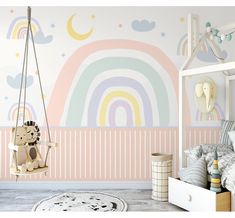 a child's bedroom decorated in pastel colors with rainbows and clouds painted on the wall