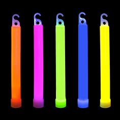 four different colored lighters are shown in the dark, one is yellow and one is pink