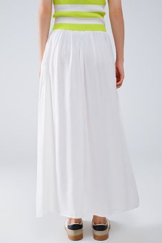 Introducing our stunning Maxi Skirt in White Fluid Fabric with Elastic Waist, a versatile and chic addition to your wardrobe that exudes effortless bohemian style. Crafted from lightweight woven fabric made of 100% viscose, this skirt offers both comfort and elegance.  The full-length design and relaxed fit create a flowing silhouette that's perfect for any occasion, whether you're strolling along the beach or attending a summer soirée. The elastic waistband ensures a comfortable and customizable fit, while side pockets add a practical touch.  Pair this skirt with a simple tank top for a casual daytime look, or dress it up with a blouse and statement jewelry for a more polished ensemble. However you style it, this maxi skirt is sure to make a statement wherever you go.  Please note that th Elegant Maxi Skirt, Tan Scarf, Flowy Maxi Skirt, Simple Tank Tops, Flowy Maxi Skirts, Boho Fabric, Summer Soiree, Skirt Jumpsuit, Scarf Headband