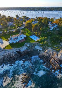 an aerial view of the ocean and houses