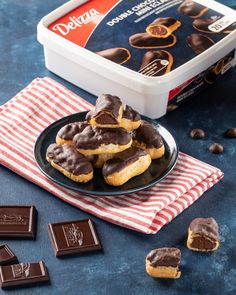 chocolate covered cookies are on a plate next to some candy