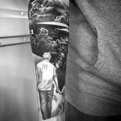 a man's arm with a painting on it