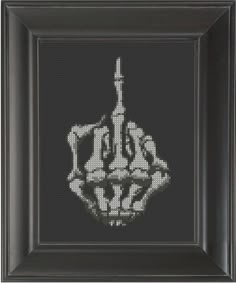 a cross stitch picture with a black frame