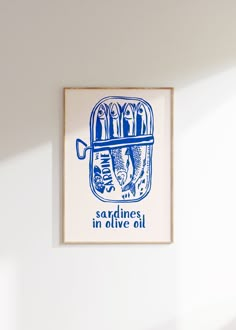 a blue and white print hanging on the wall