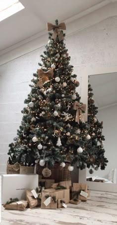 a christmas tree with presents under it