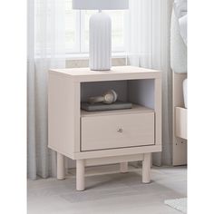 a night stand with two drawers and a white lamp on the end table next to it