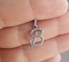 "14K SOLID WHITE GOLD INITIAL PENDANT - NECKLACE WITH DIAMONDS Metal : 14K Solid Gold Necklace Length : 16 inches / 40cm Letter Height : 19.75mm Letter Width : 10.50mm Letter Thickness : 1.9mm Diamond : 36 Diamonds --- Nice White Color Sparkle Diamonds ---- G-H color SI2 clarity Total Carat: 0.36 Carat (Depending on the letter) ---MADE IN USA--- ---All letters from A to Z are available. Please indicate your letter choice in the \"notes to seller\" section on the order. ---This is a beautiful 14K White Gold Vvs Clarity Initial Pendant, Letter B Necklace, Initial Necklace Diamond, B Necklace, Gold Initial Pendant, Diamond Initial Necklace, Solid Gold Necklace, Initial Necklace Gold, Necklace Diamond