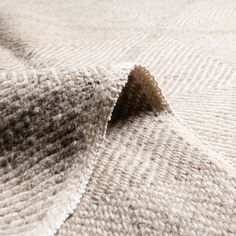 closeup of the textured fabric on a bed sheet that has been made into a blanket