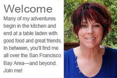 a woman with red hair and blue shirt is smiling at the camera while she has an ad for san francisco bay area beyond her