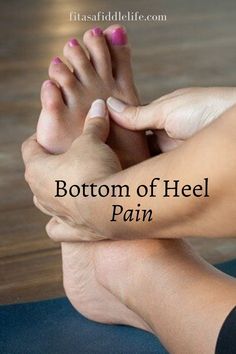 the bottom of a person's feet with their hands on top of each other